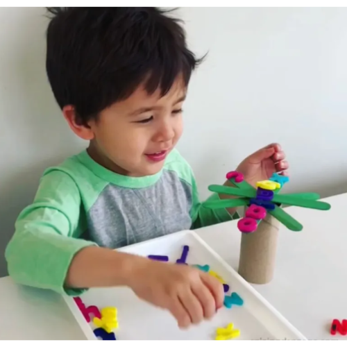 Little boy playing the Chicka Chicka Boom Boom Challenge